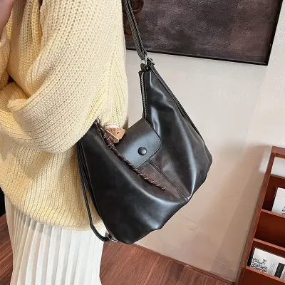 RADIANT EMBRACE HANDBAG